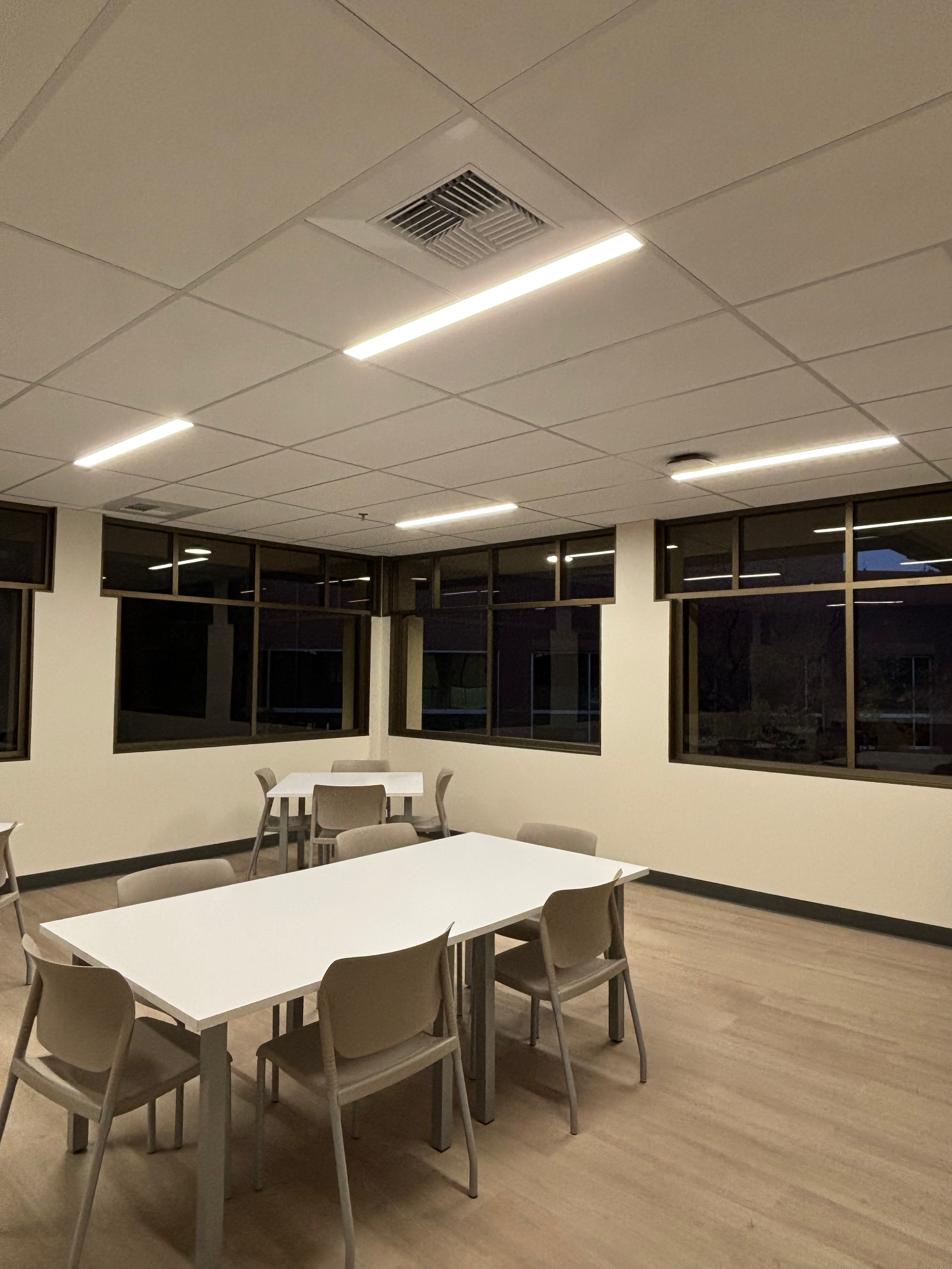 Office lighting with LED panel fixtures